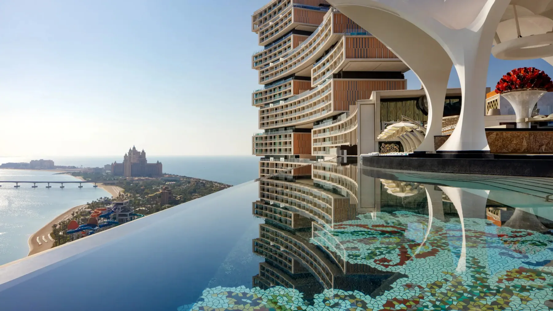 Atlantis The Royal rising above a rooftop infinity pool