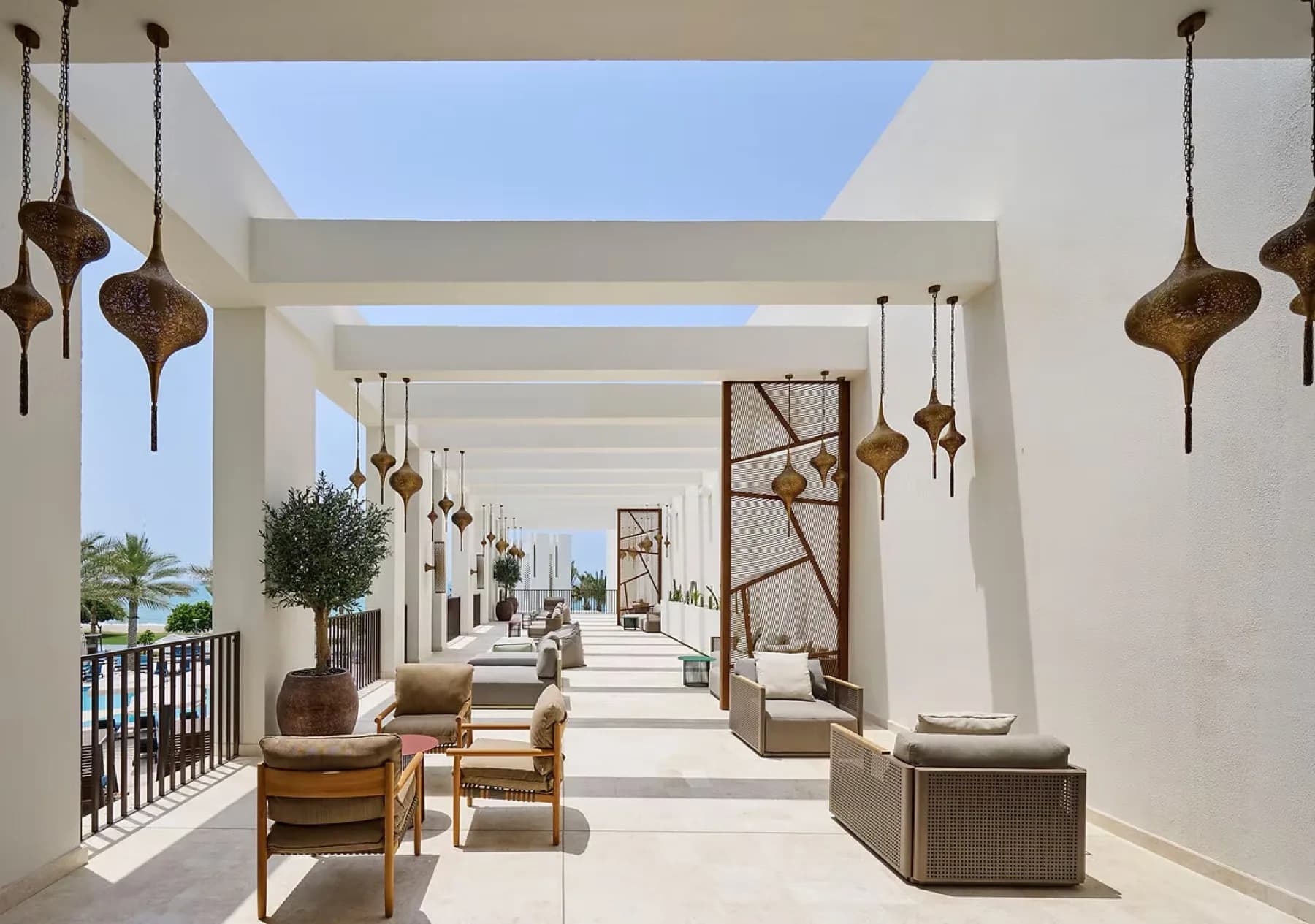 Mandarin Oriental Muscat resort exterior with outdoor seating